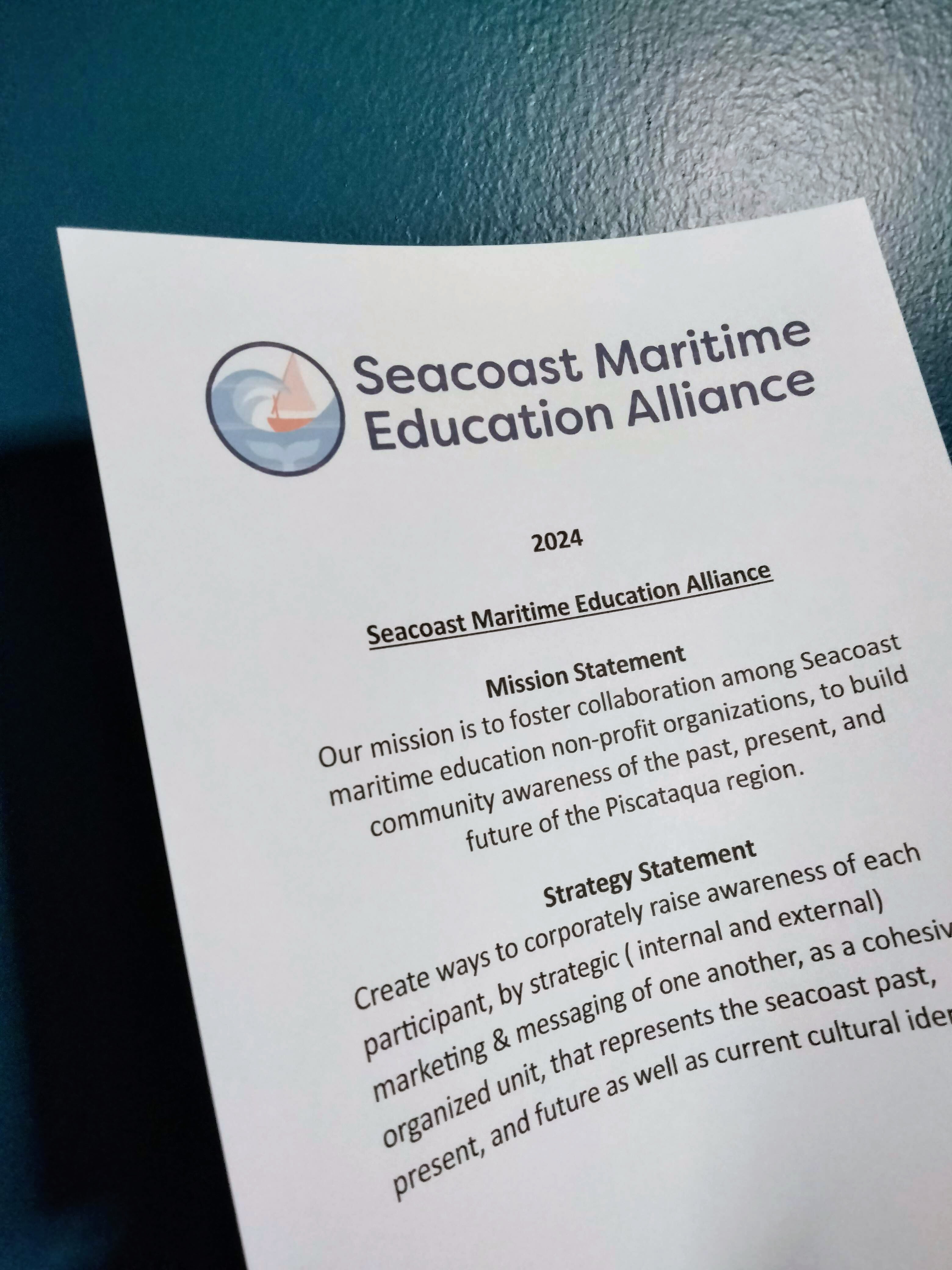 Photo of horizontal version of logo on a document.